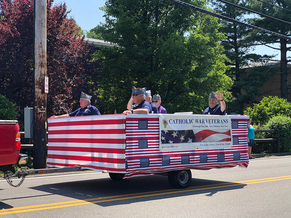 The Catholic War Veterans floats make their way along the procession.